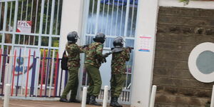 Anti-riot police lob teargas at the Multi Media University students on Friday, November 20.