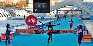 Athlete Kibiwott Kandie crosses the winning line at the half marathon in Valencia, Spain, on Sunday, December 6, 2020.