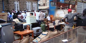 Auctioneers seize property at a past raid in Kenya.