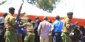 Police officers calm down supporters of Migori Governor Okoth Obado and Senator Ochillo Ayacko after they clashed at a rally in August 2016