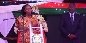 Azimio One Kenya running mate Martha Karua addresses the gathering as DP William Ruto watches at the National Prayer breakfast on Thursday,May 26, 2022.