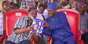 Azimio party leader Raila Odinga and Kalonzo Musyokaaddresses mpurners during the burial of Mama Baraa in Kakamega County on Monday, October 31, 2022.