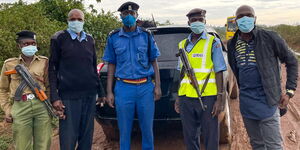 BBC News anchor Larry Madowo (right) and police officers from Ukwala Police Station in Siaya on Thursday, December 31, 2020.