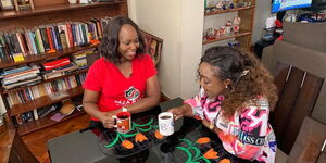 K24 TV news anchor Betty Kyallo (right) with sports personality Carol Radull at her home in Nairobi on March 20, 2020.