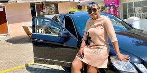Betty Kyallo pictured next to her Mercedes Benz