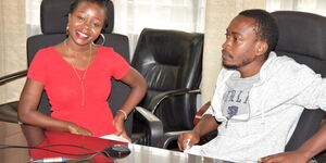 Survivors of Covid-19 pandemic Brenda (left) and Brian who got cured of the disease speak to President Uhuru Kenyatta at Afya House on Wednesday, April 1, 2020.