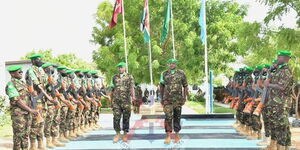 Brigadier Jeff Nyagah (left) and Brigadier Paul Njema (right) during a parade inspection at AMISOM Sector II Headquarters in Dhobley in February 2021