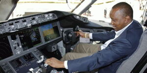 President Uhuru Kenyatta inside an aircraft's cockpit at a past event.