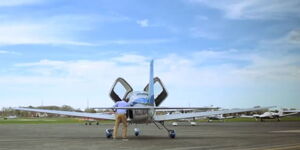 Captain Tom Rege performing pre-flight checks on one of his flight school planes.