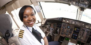 Captain Irene Koki Mutungi poses for a photo before commanding a past flight.