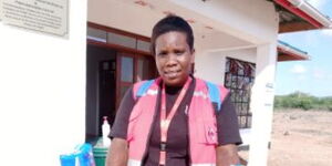 Kenya Red Cross Volunteer, Milka Hadida, in front of W.W.F Community Disaster Rescue & Preparedness Centre at Galole sub-county 