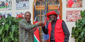 A file image of President Uhuru Kenyatta (left) with Kariri Njama.