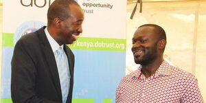 File image of Michael Onyango (left), the former ICT minister of Kisumu county at the Digital Opportunity Trust(DOT) Kenya. 