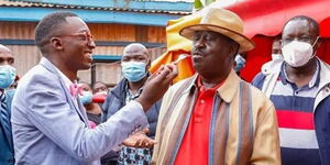 ODM leader Raila enjoys a piece of cake from Gideon Gachuki on Saturday, September 4.