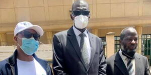 NMS Deputy Director (centre) Musa Mohammed and his legal team outside Milimani Law Courts on Monday, February 15.