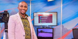 Ngugi wa Karanja posing for a photo inside Kameme TV studios 