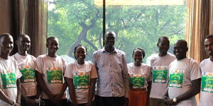 Turkana Governor Jackson Mandago (center) posing for a photo alongside eight youth on Saturday, November 13.