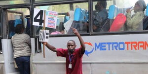 Jobson Motari Sibota, calling for passengers to board Metro Trans vehicle in Nairobi