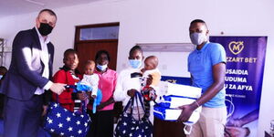 Mozzartbet contributes a bag of goodies to the family of Elizabeth Wanjiku at Waithaka Health Centre, on Monday, November 8.