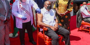 President Uhuru Kenyatta receiving his booster dose on Friday, December 31.
