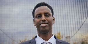 Minnesota official and former Kenyan refugee Hamse Warfa posing for a photo.