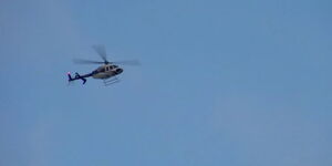 An image of a helicopter flying in the air.