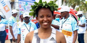 Damaris Muthee Mutua (pictured) poses for a photo after winning a past race. 