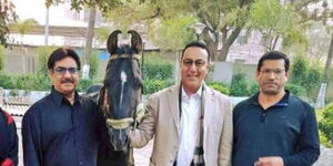 Tourism Cabinet Secretary Najib Balala (centre) poses alongside his family relatives. 