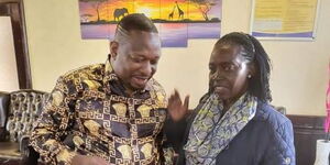 Former Nairobi governor Mike Sonko shares a light moment with Azimio la Umoja running mate, Martha Karua at Wilson Airport on Tuesday, July 12