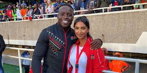 Kenya's sensational athlete, Ferdinand Omanyala (left) poses for a photo alongside Sports CS Amina Mohamed's daughter, Firyal Al Hossain on May 7, 2022, at Kasarani stadium.