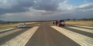 Cars at Nyaribo airstrip in Nyeri