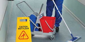 File photo of a person cleaning the floor