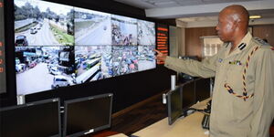A police officer monitoring CCTV cameras mounted in Nairobi 