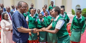 President Uhuru Kenyatta interacts with students of Nyiro Girls’ Secondary School, Samburu County at State House, Nairobi after donating a bus to the school on Friday, November 1, 2019.