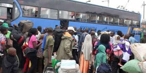A file image of passengers scrambling to board a bus at Country Bus Station, Nairobi.