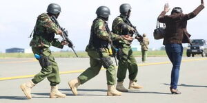 DCI officers during a sting operation at the Jomo Kenyatta International Airport (JKIA) in June 2021.