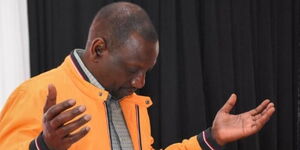 DP William Ruto bowing during a past prayer session.