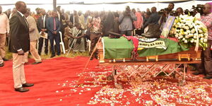 Deputy President William Ruto views Sergeant Kipyegon Kenei's Casket during his burial ceremony  in Nakuru on Saturday, March 7, 2020.