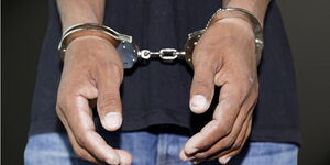 Undated image of a man in handcuffs