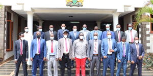 Deputy President William Ruto (Red Trouser) and Members of the County Assembly of Wajir pose for a photo on November 16, 2020.