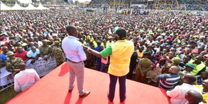 Deputy President William Ruto (in yellow) and Kakamega Senator Cleophas Malala