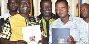 Deputy President William Ruto (left) accepts MCC leader Alfred Mutua into Kenya Kwanza on Monday, May 9, 2022.