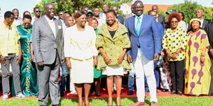 Deputy President William Ruto (right) and his running mate Rigathi Gachagua (left) pose for a photo with their significant others.
