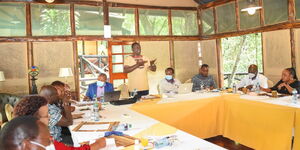Deputy President William Ruto (standing) addresses Mt Kenya leaders during a three-day meeting.