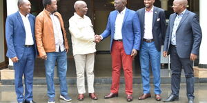 President William Ruto (third right) receives former Makueni Governor Kivutha Kibwana (third left) into Kenya Kwanza.