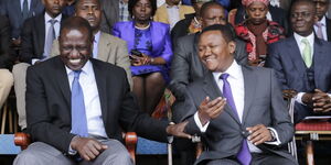 Deputy President William Ruto and Machakos Governor Alfred Mutua share a light moment