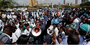 Medical professionals engaging in demonstration.