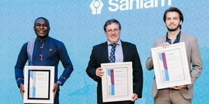 Donald Magomere (left), a reporter at Financial Times, poses with his award at Sanlam Award Gala in South Africa on Friday, November 13, 2020.