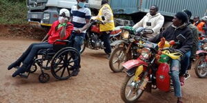 Dorothy Gachie wheeling herself as she embarks on Ksh130KM journey from Embu to Nairobi on July 22, 2020.