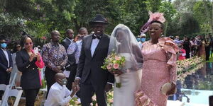 June Ruto walks down the aisle accompanied by her parents DP William Ruto and Rachel Ruto on Thursday, May 27.